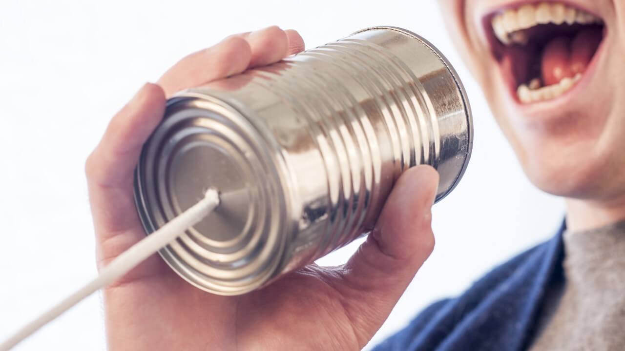 Man speaking into a tin can phone | keys to killer case studies